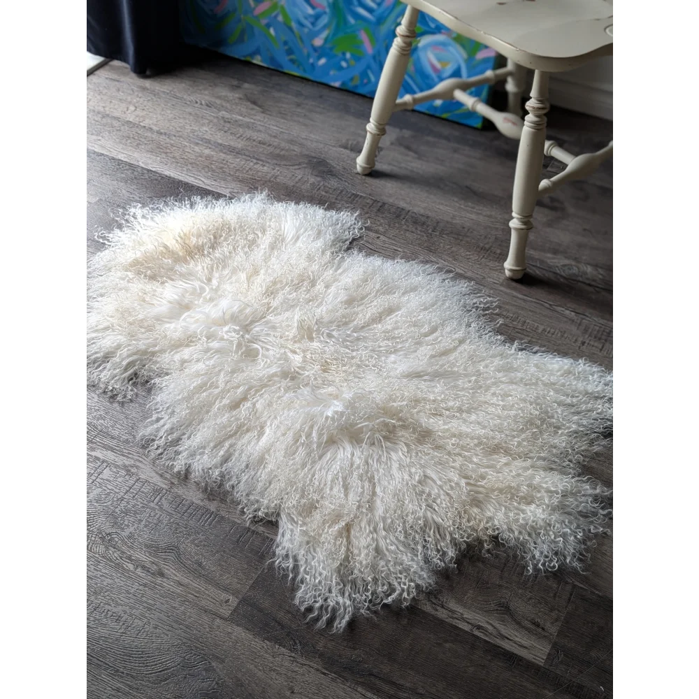 Gorgeous white fluffy Mongolian sheepskin rug by Angus Oliver