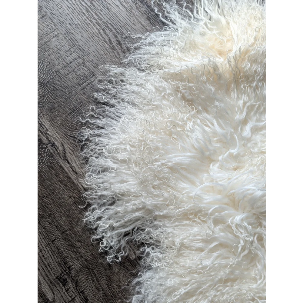 Gorgeous white fluffy Mongolian sheepskin rug by Angus Oliver
