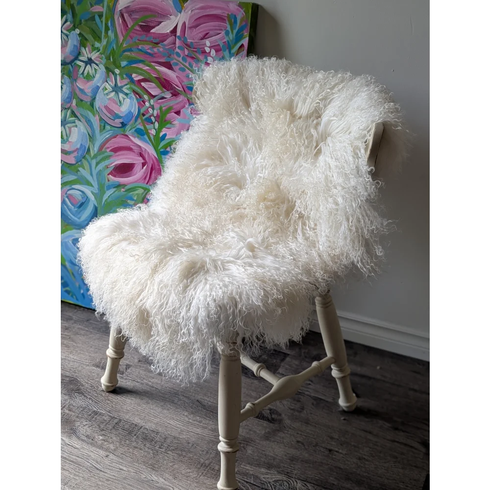 Gorgeous Angus Oliver Mongolian sheepskin on white fur armchair