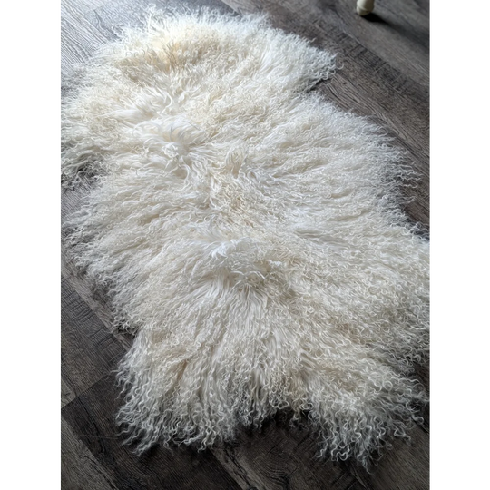 Gorgeous white fluffy Mongolian sheepskin rug by Angus Oliver