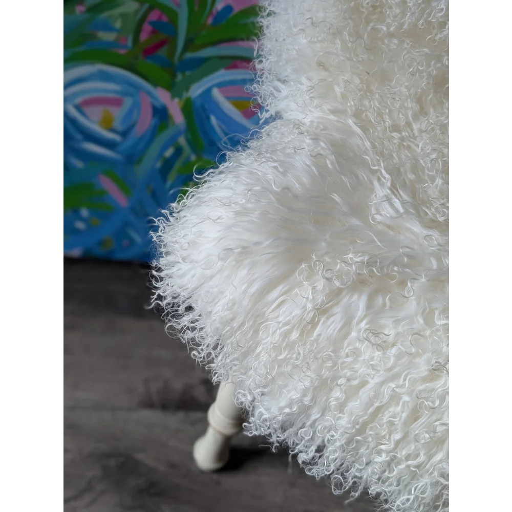 Gorgeous Mongolian sheepskin throw pillow with shaggy texture and wooden legs by Angus Oliver