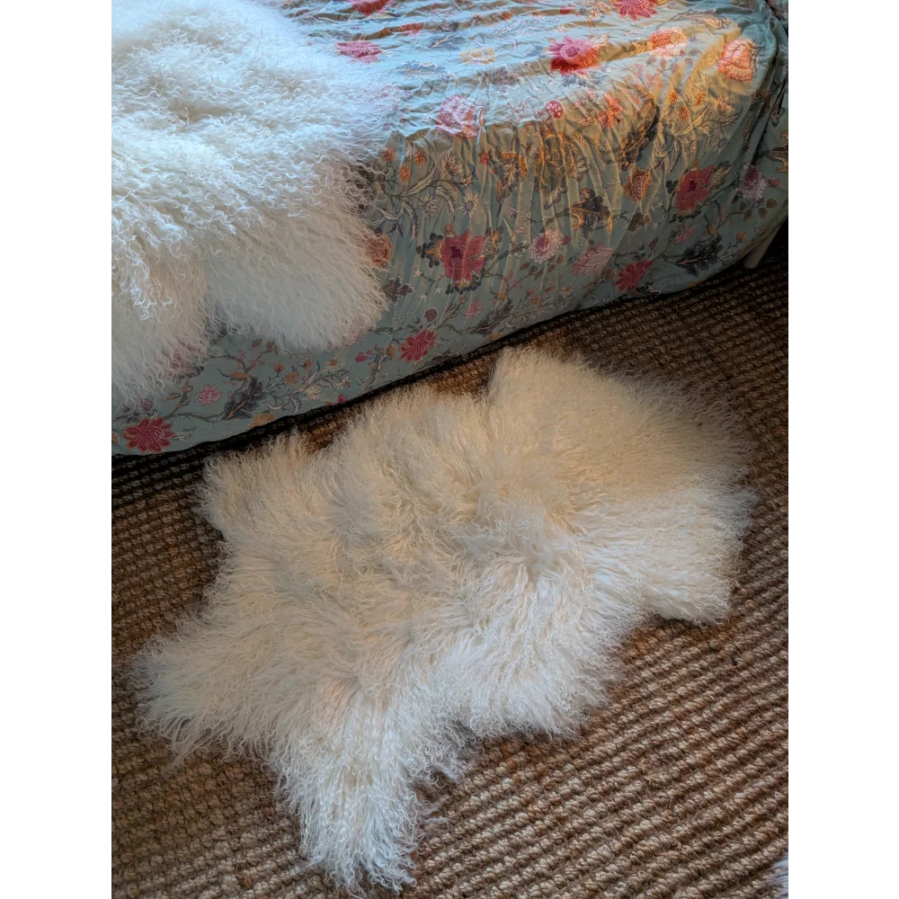 Gorgeous white fluffy Mongolian sheepskin throw pillow with floral backing by Angus Oliver