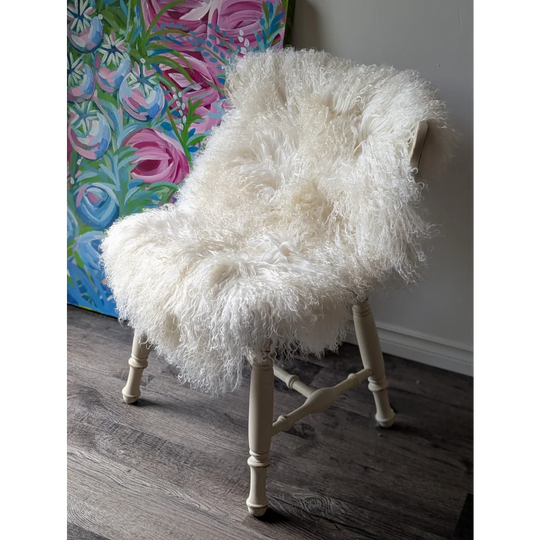 White fluffy armchair with wooden legs, gorgeous Angus Oliver Mongolian sheepskin