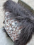 Cozy browny black icelandic hat with speckled natural cowhide fabric and dark gray faux fur lining perfect for long wool days