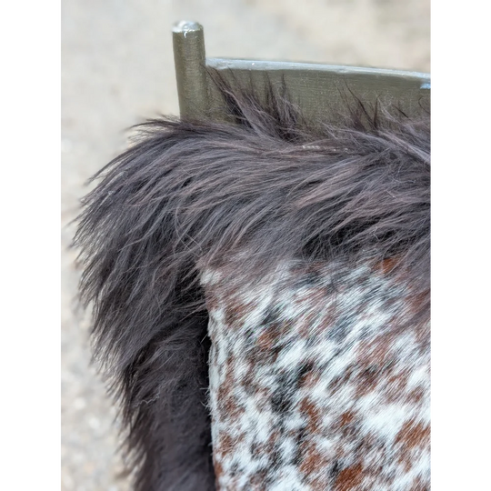 Speckled cowhide pillow with dark brown fluffy faux fur trim and long wool detail perfect for sewing machines projects