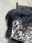 Speckled cowhide pillow with natural cowhide spots and fluffy black long wool faux fur trim perfect for cozy decor