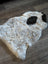 A plush icelandic sheepskin rug with short wool in off-white and black patches spot10 39 x 25.5 inches