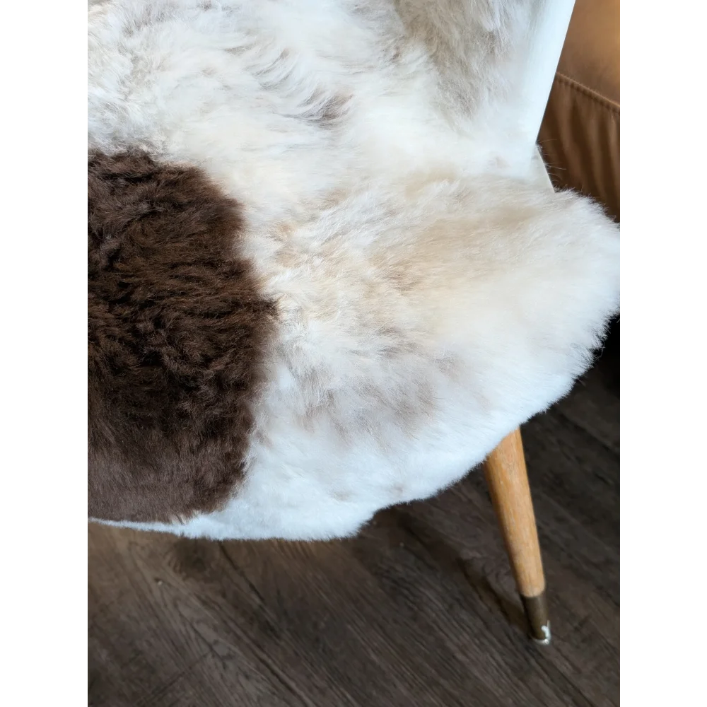 Cozy two-toned icelandic sheepskin chair cover with plush white and brown short wool fur texture medium size