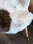 Cozy two-toned icelandic sheepskin chair cover with plush white and brown short wool fur texture medium size