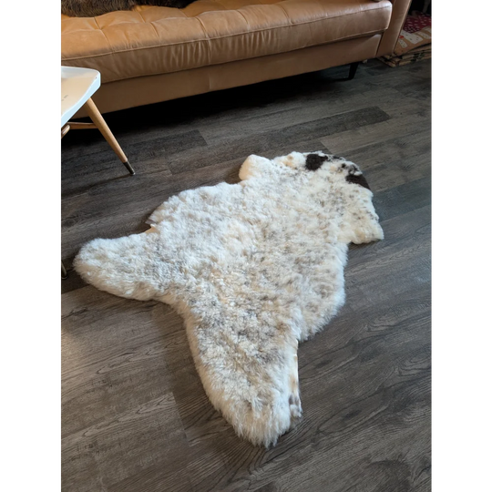 White and black speckled icelandic sheepskin rug with fluffy short wool natural texture 49.5 x 31 inches