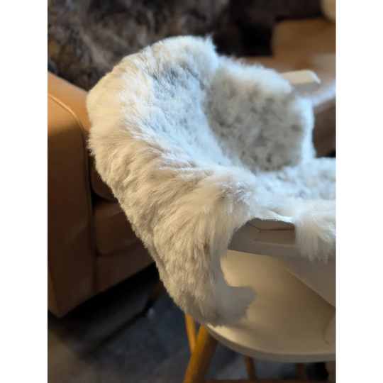 White faux fur baby high chair cover with soft icelandic sheepskin short wool texture in large 50 x 30.5 size