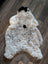 Fluffy medium spotted icelandic sheepskin rug with soft cream and grayish white short wool and black patches