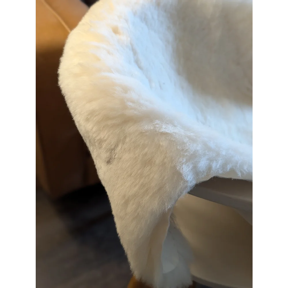 White faux fur throw blanket with soft plush texture made from large spotted icelandic sheepskin short wool