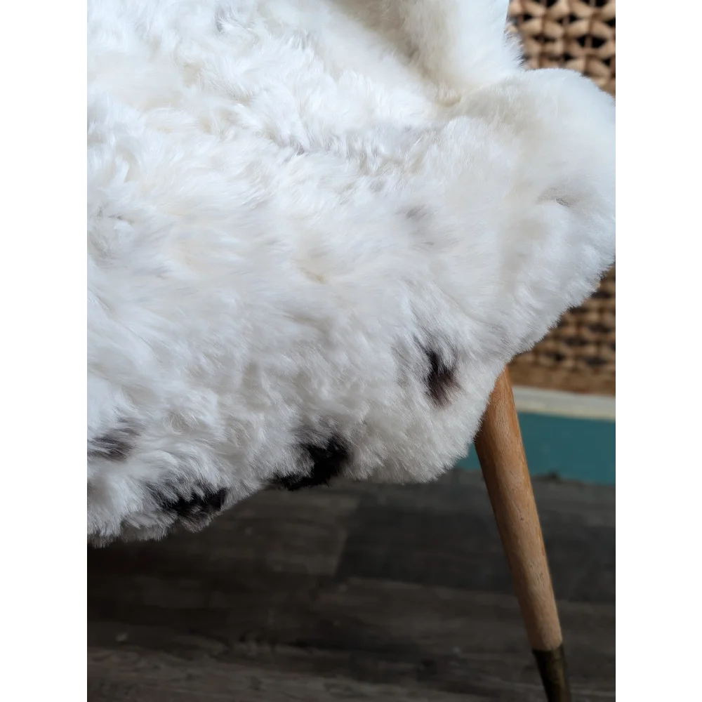 White fluffy large spotted icelandic sheepskin rug with black spots 41 by 32 inches soft short wool