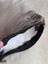 A gray cotton canvas squirrel coin purse with a sheepskin tail and faux fur lining with a black zipper