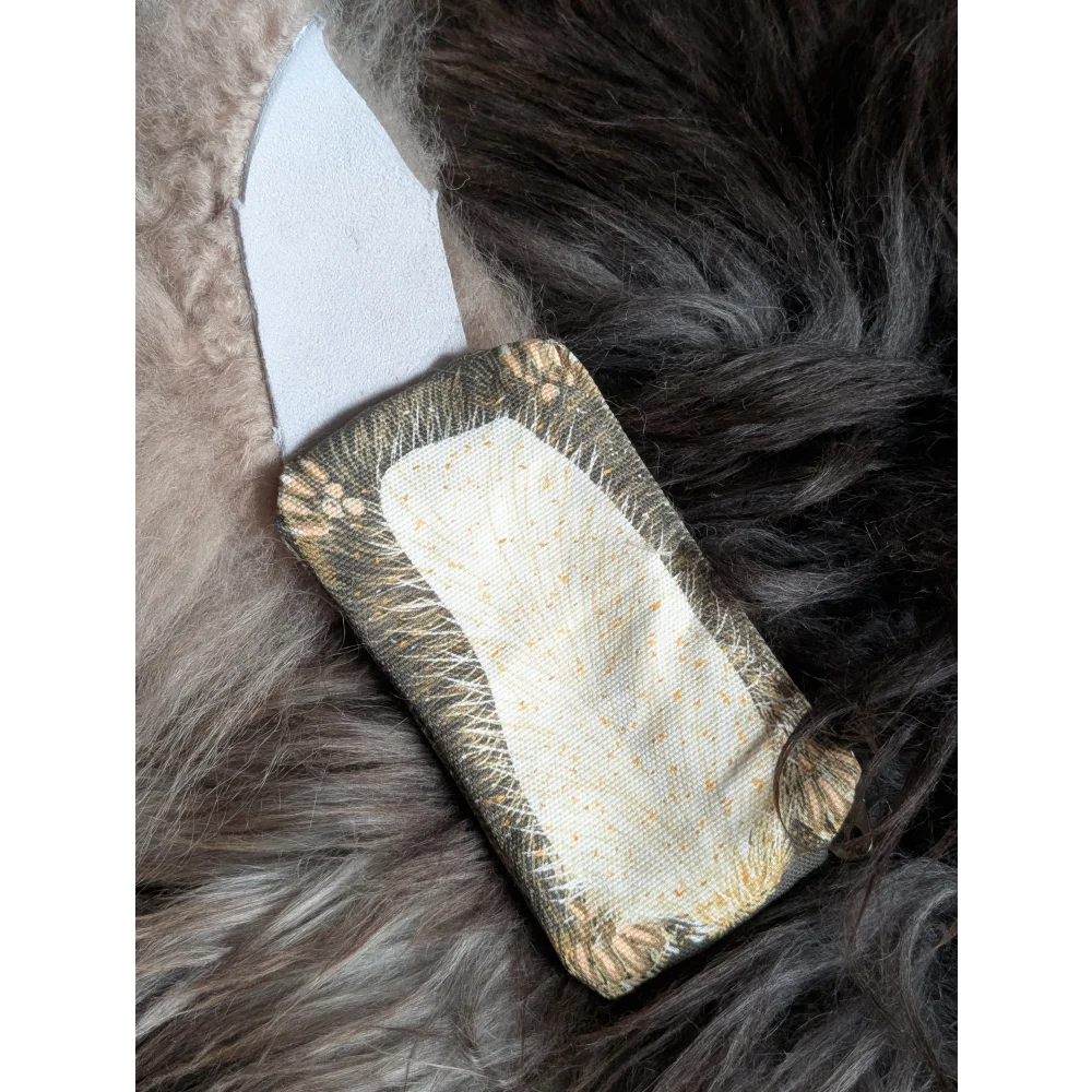Squirrel coin purse made of olive green cotton canvas with cream floral edges and a soft sheepskin tail detail