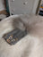 Gray squirrel coin purse made of cotton canvas with a fluffy sheepskin tail attachment for storing coins