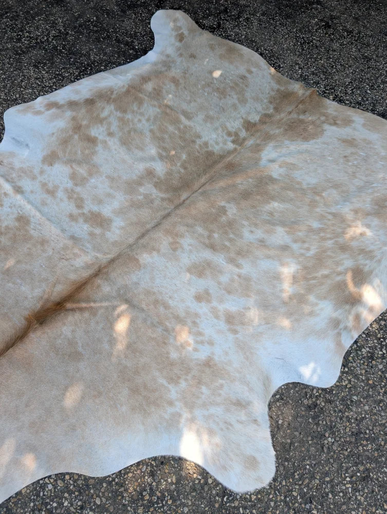 Large cowhide rug ss835 with natural tones white and tan patches showcasing rustic charm and beautiful rugs style