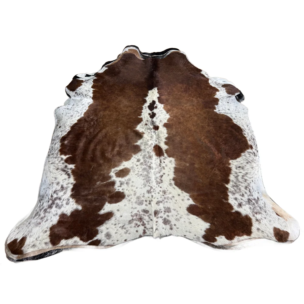 Ss873 large cowhide rug with beautiful irregular dark brown patches on a white base showcasing unique characteristics