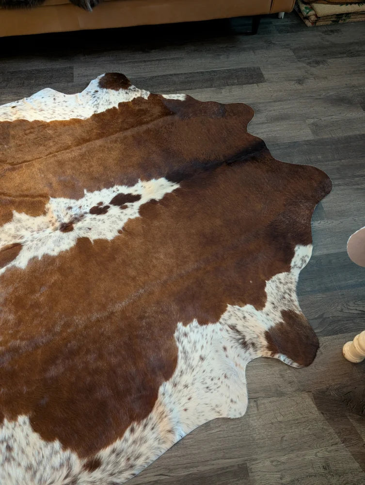 Ss873 large cowhide rug with beautiful brown and white natural fur texture showcasing unique characteristics