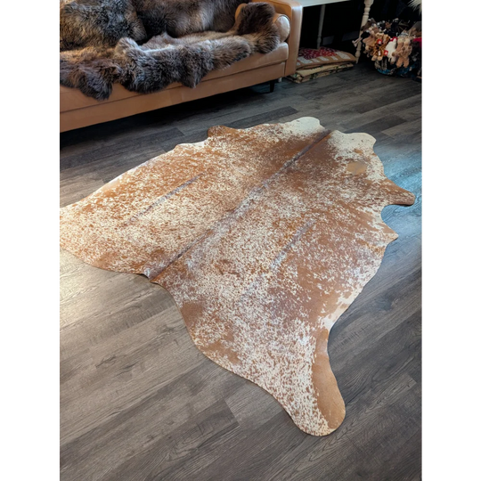82x74 large cowhide rug with beautiful brown and white speckled pattern and unique natural edges perfect for decor