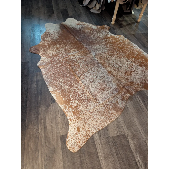 82x74 beautiful large cowhide rug with brown and white speckled natural edges showing unique characteristics