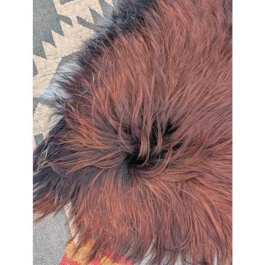 Plush extra large icelandic sheepskin rug in reddish brown with long wool icelandic fur texture perfect for cozy spaces