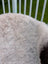 A plush light gray large icelandic sheepskin throw blanket with soft long wool by angus oliver measuring 44 x 33 inches