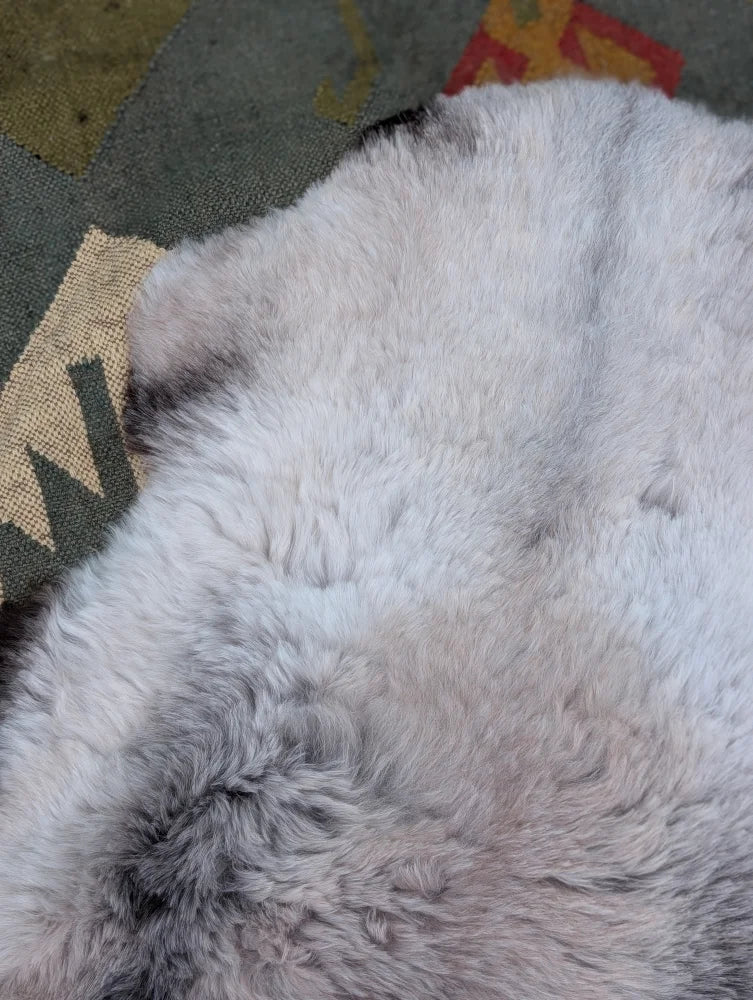 A soft fluffy white and gray long wool icelandic sheepskin rug 43.5 x 33 by angus oliver with natural textured fur