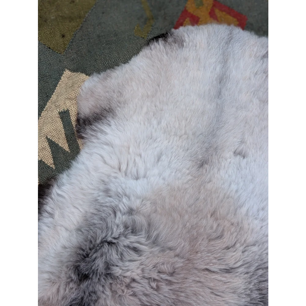 A soft fluffy white and gray long wool icelandic sheepskin rug 43.5 x 33 by angus oliver with natural textured fur