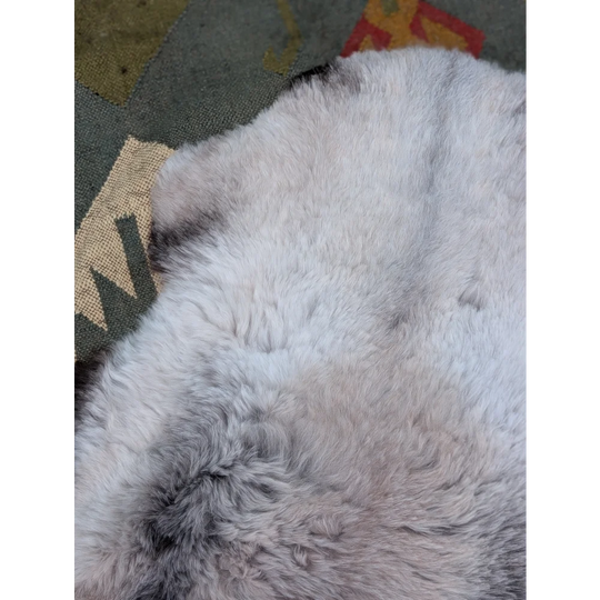 A soft fluffy white and gray long wool icelandic sheepskin rug 43.5 x 33 by angus oliver with natural textured fur