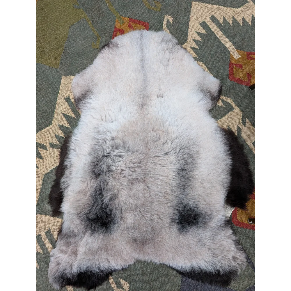 A soft fluffy gray and black long wool icelandic sheepskin rug 43.5 by 33 inches by angus oliver