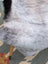 A large gray icelandic sheepskin throw with soft long wool and subtle gradient perfect for cozy decor by angus oliver
