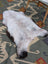A fluffy 44 x 27 inch large icelandic sheepskin rug with long wool icelandic texture in white to dark brown by angus oliver