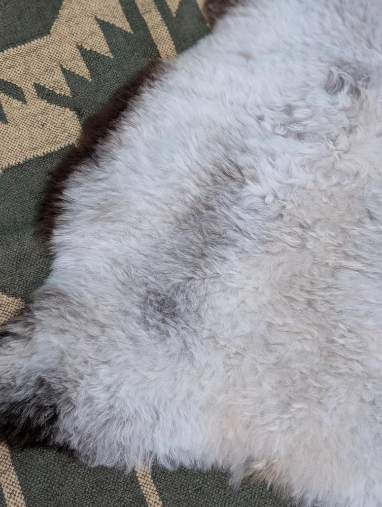 Large 44.5 x 31 inch soft fluffy white icelandic sheepskin rug with natural gray and black markings angus oliver
