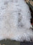 A large 44.5 x 31 inch soft fluffy icelandic sheepskin rug with long wool and natural gray beige undertones by angus oliver
