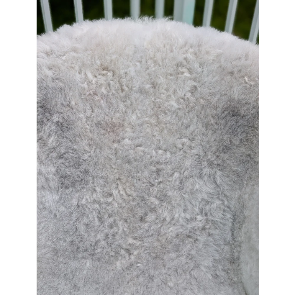 A large soft gray icelandic sheepskin throw with long wool icelandic curly texture by angus oliver