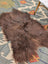 A massive 58 by 35 inch thick brown icelandic sheepskin rug with long wool icelandic texture by angus oliver