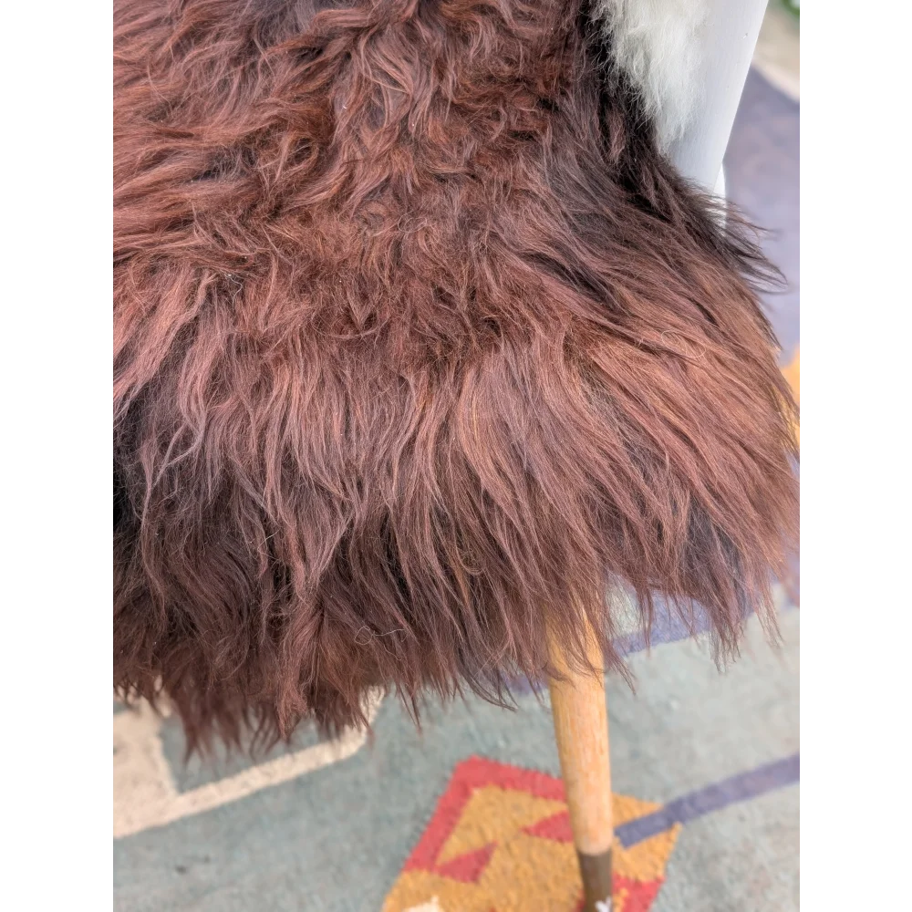 A plush deep brown extra large icelandic sheepskin coat with long thick wool icelandic fur measuring 48 by 33 inches