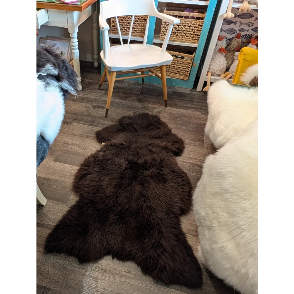 Dark brown fluffy extra large british sheepskin rug with natural fur texture by angus oliver 53 x 30 inches