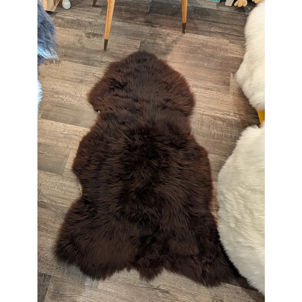Rich dark brown extra large british sheepskin rug with plush natural fur texture by angus oliver