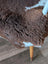 Brown and white tibet highland spotted grade a- sheepskin rug with plush textured surface from nat’s grade collection