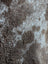 Brown and beige mottled plush tibet highland spotted grade a- sheepskins fabric from nat’s grade collection