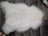 A plush off-white icelandic sheepskin rug with long fluffy fibers from a curated collection of wool icelandic sheepskins
