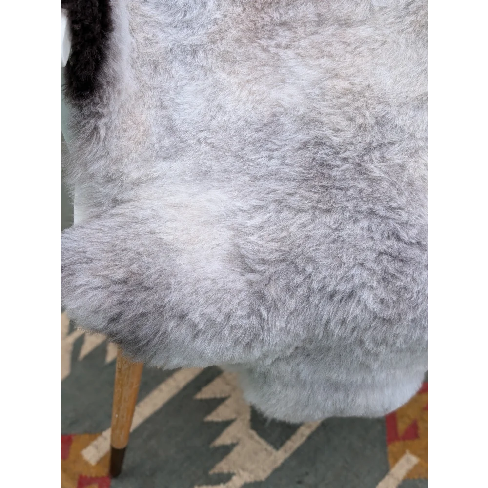 A plush soft gray long wool icelandic sheepskin rug with natural fluffy texture by angus oliver