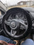 Black sheepskin steering wheel cover with fur trim and Mazda logo by Angus Oliver