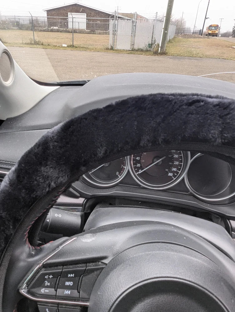 Black faux fur steering wheel cover by Angus Oliver