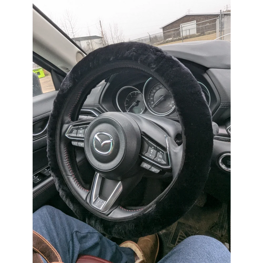 Black fuzzy Angus Oliver steering wheel cover with textured grip