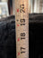 White measuring tape on Angus Oliver Stump Pouf Icelandic sheepskin