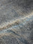 Soft textured gray faux fur with beige and blue edge on large lovely cowhide rug showing unique characteristics
